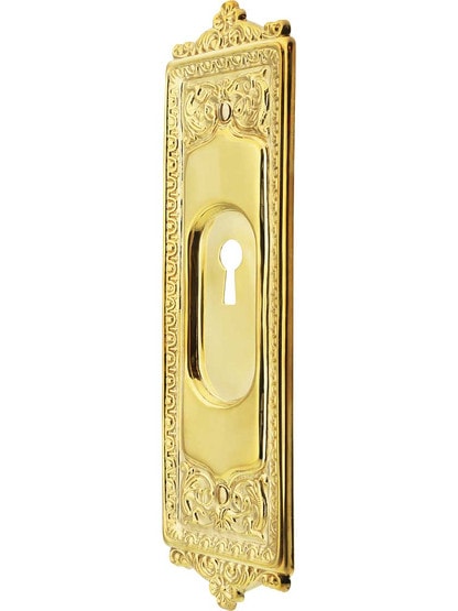Egg and Dart Solid-Brass Pocket Door Pull With Keyhole in Un-Lacquered Brass.